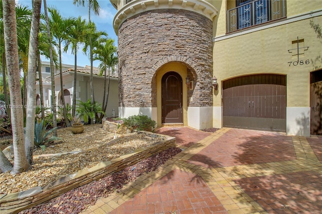 view of exterior entry featuring a garage