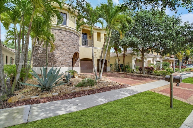 view of front of property with a balcony