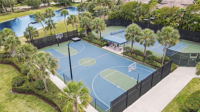 view of basketball court featuring a water view