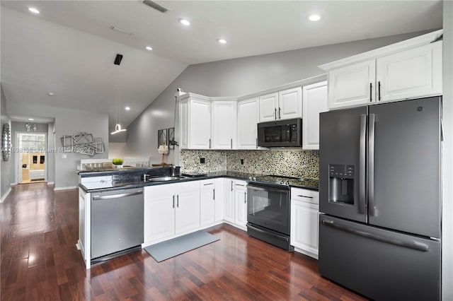 kitchen with kitchen peninsula, dark hardwood / wood-style flooring, vaulted ceiling, and black appliances