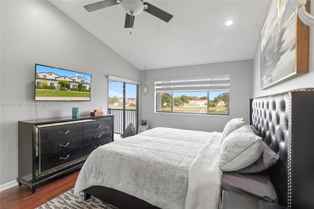 bedroom with ceiling fan, dark wood-type flooring, and vaulted ceiling