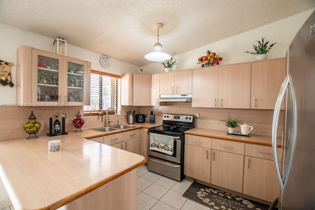 kitchen with kitchen peninsula, light brown cabinetry, stainless steel appliances, and sink