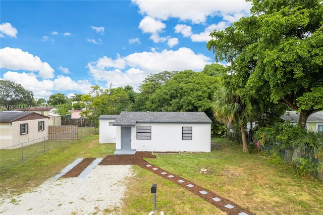 view of outbuilding featuring a lawn