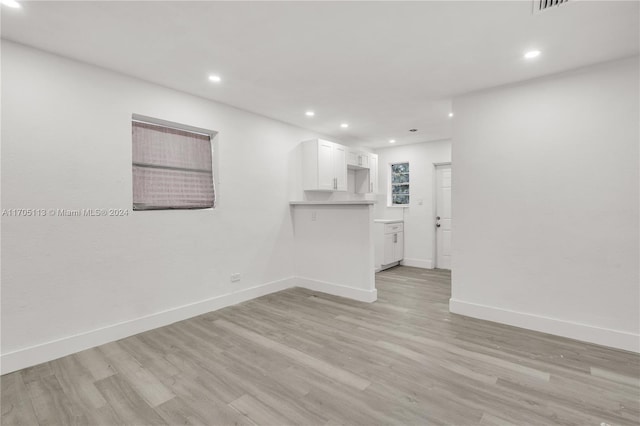 unfurnished living room featuring light wood-type flooring