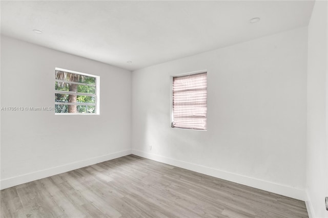 spare room with light wood-type flooring