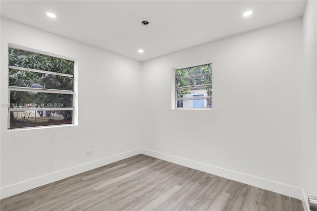 spare room featuring light wood-type flooring