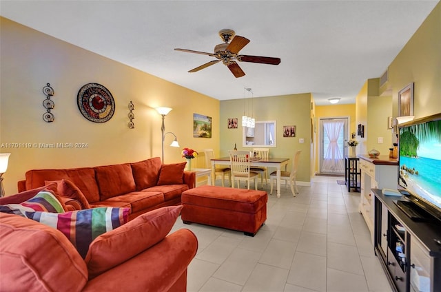 living room featuring ceiling fan and light tile patterned flooring