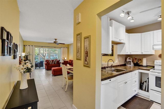 kitchen featuring white appliances, exhaust hood, sink, ceiling fan, and white cabinetry