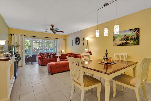 dining room featuring ceiling fan and light tile patterned floors