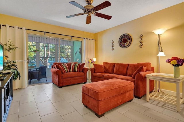 tiled living room with ceiling fan