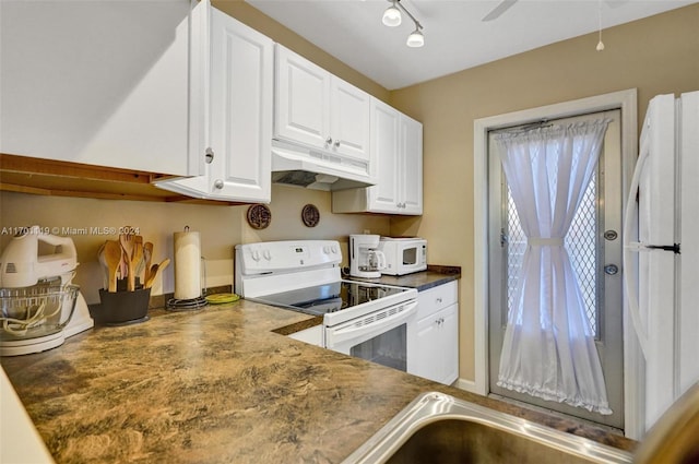 kitchen with white cabinetry, white appliances, and rail lighting