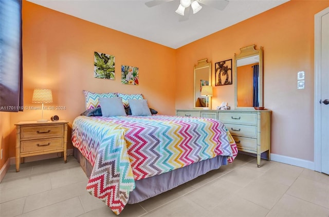 bedroom with ceiling fan and light tile patterned floors