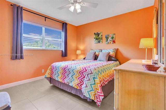 tiled bedroom with ceiling fan