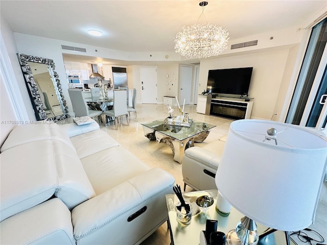 living room featuring a notable chandelier