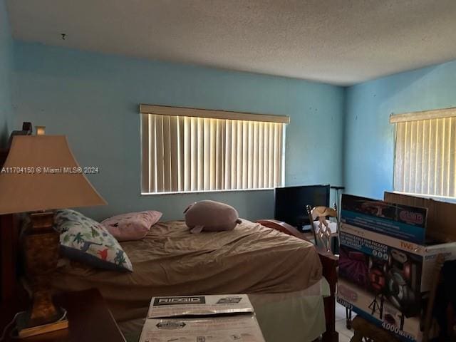 bedroom featuring a textured ceiling