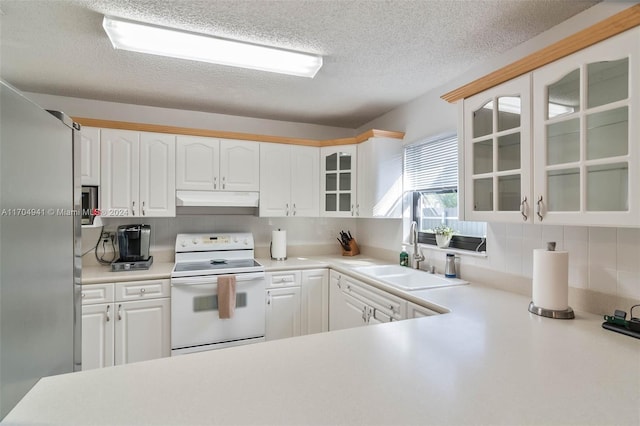 kitchen with white range with electric cooktop, white cabinetry, and sink