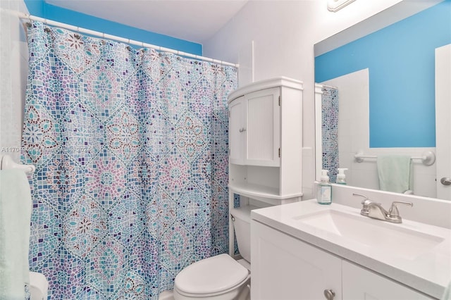 bathroom with a shower with curtain, vanity, and toilet