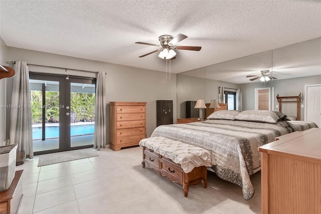 tiled bedroom with access to outside, ceiling fan, and a textured ceiling