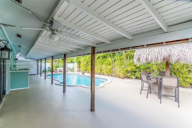 view of swimming pool with a patio area and ceiling fan