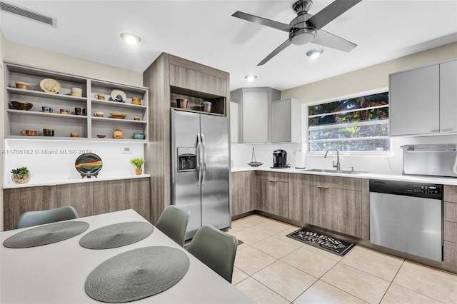 50 SW 130th Ave, Miami, FL 33184 - kitchen featuring ceiling fan, light tile patterned floors, sink, and appliances with stainless steel finishes