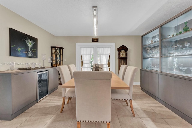 50 SW 130th Ave, Miami, FL 33184 - tiled dining space with a textured ceiling, beverage cooler, and bar area