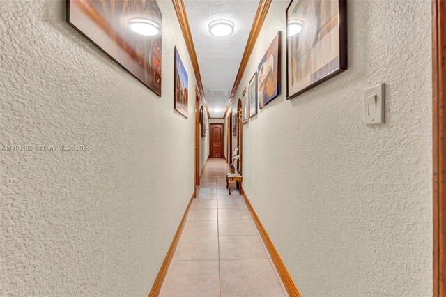 50 SW 130th Ave, Miami, FL 33184 - hallway featuring light tile patterned floors and a textured ceiling