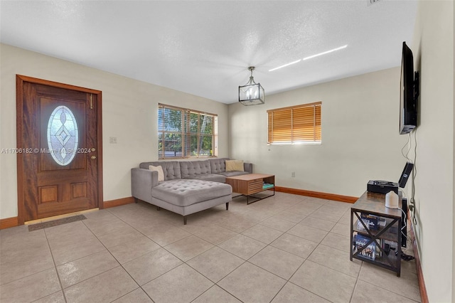50 SW 130th Ave, Miami, FL 33184 - living room with plenty of natural light, light tile patterned floors, a chandelier, and a textured ceiling