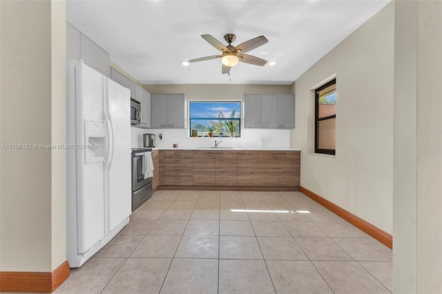 50 SW 130th Ave, Miami, FL 33184 - kitchen featuring ceiling fan, sink, stainless steel appliances, gray cabinets, and light tile patterned floors