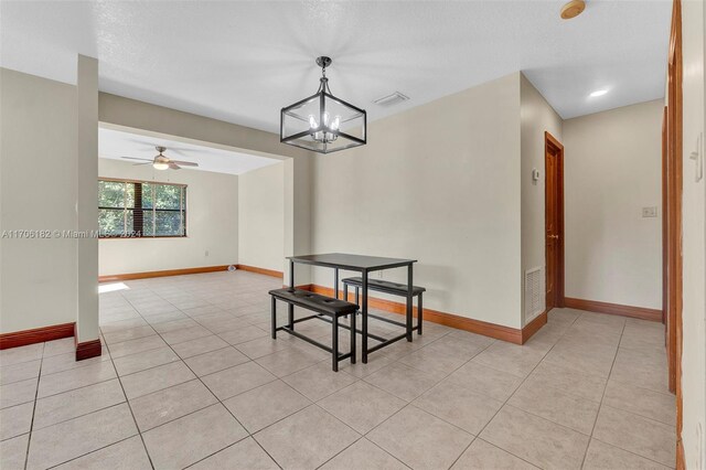 50 SW 130th Ave, Miami, FL 33184 - tiled dining space with a textured ceiling and ceiling fan with notable chandelier