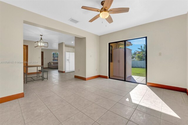 50 SW 130th Ave, Miami, FL 33184 - tiled empty room featuring ceiling fan with notable chandelier