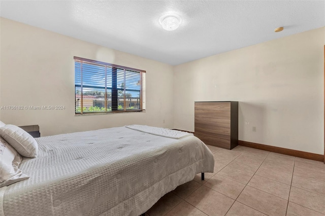 50 SW 130th Ave, Miami, FL 33184 - tiled bedroom with a textured ceiling