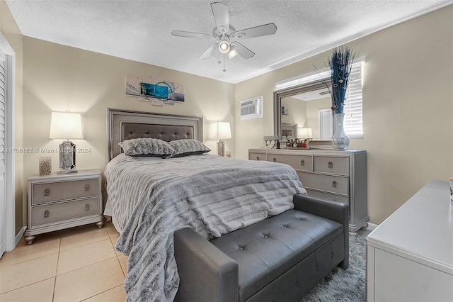 50 SW 130th Ave, Miami, FL 33184 - bedroom with ceiling fan, light tile patterned floors, a textured ceiling, and an AC wall unit