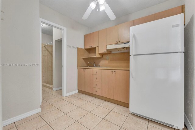 50 SW 130th Ave, Miami, FL 33184 - kitchen with white refrigerator, light tile patterned floors, and light brown cabinetry