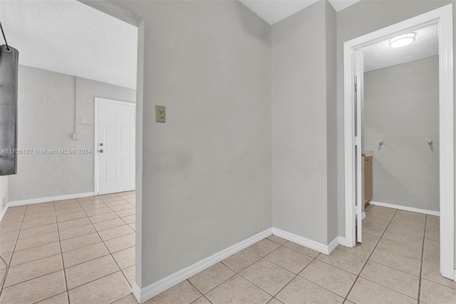 50 SW 130th Ave, Miami, FL 33184 - hallway featuring light tile patterned floors and a textured ceiling