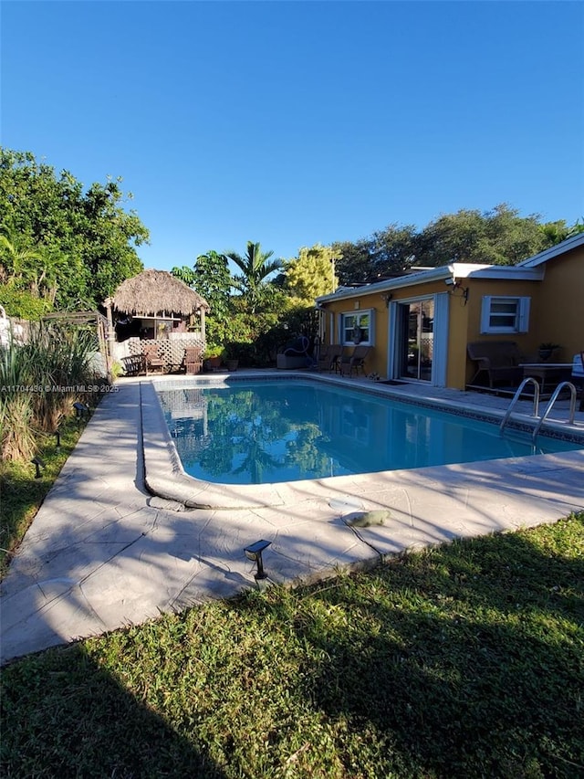 view of swimming pool with a gazebo