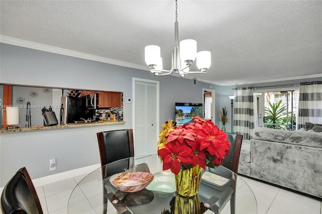 dining area featuring crown molding, light tile patterned flooring, a textured ceiling, and an inviting chandelier