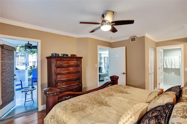 bedroom featuring hardwood / wood-style flooring, ornamental molding, access to outside, and connected bathroom