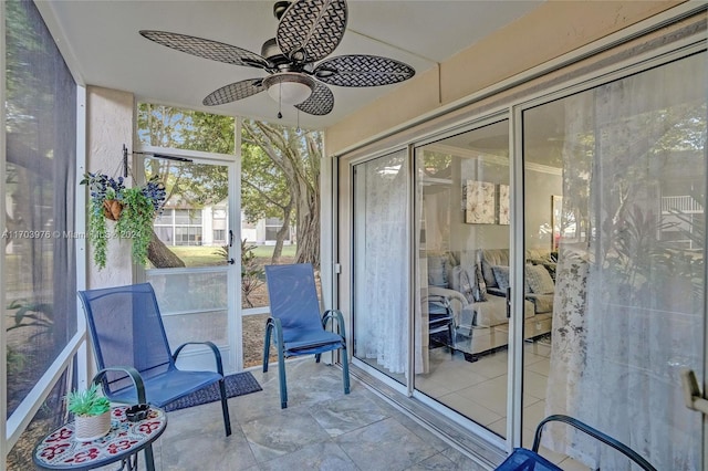 sunroom / solarium with ceiling fan