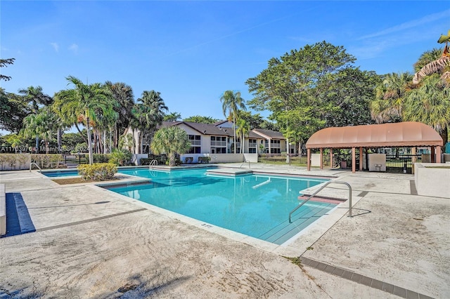 view of swimming pool featuring a patio