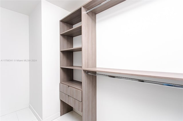 walk in closet featuring light tile patterned floors