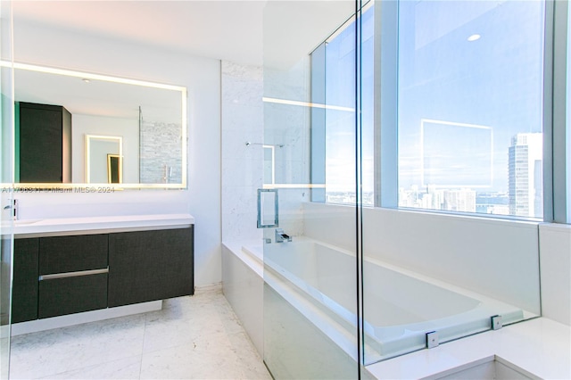 bathroom featuring vanity and separate shower and tub