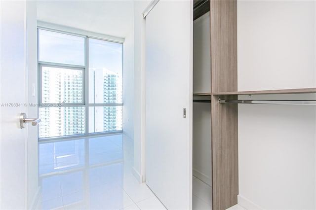 spacious closet featuring light tile patterned floors