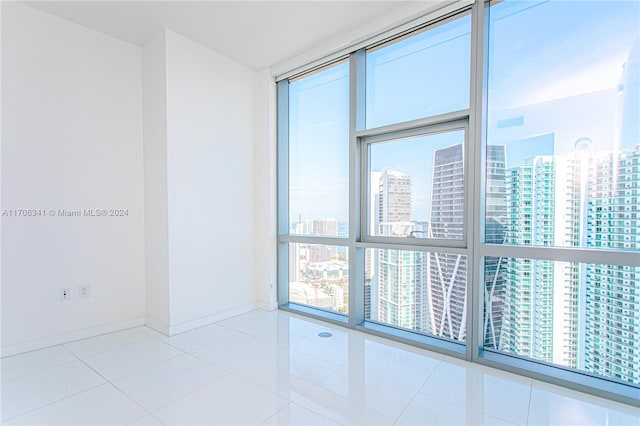 tiled empty room with expansive windows