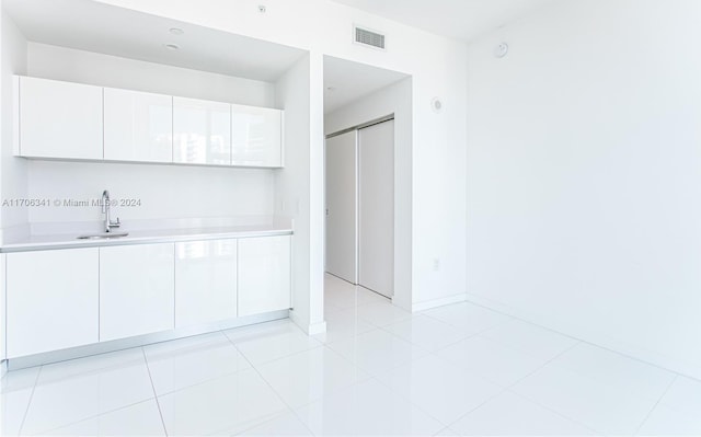 interior space with tile patterned floors and vanity