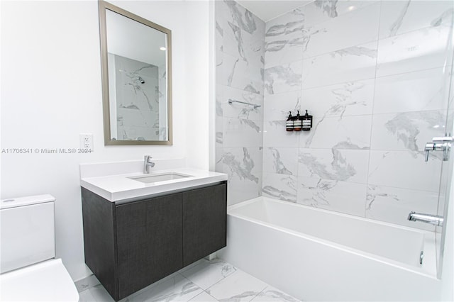 full bathroom with vanity, tiled shower / bath combo, and toilet