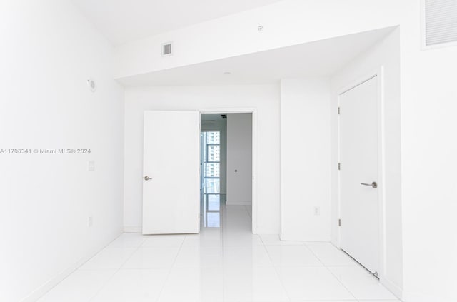 spare room with light tile patterned floors