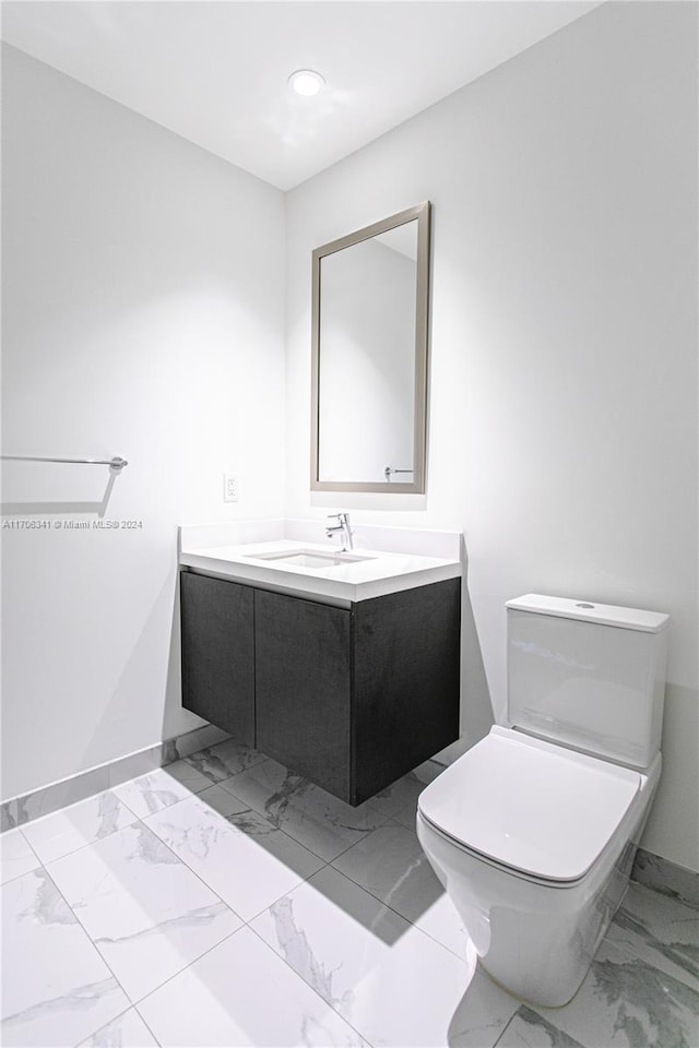 bathroom with vanity and toilet