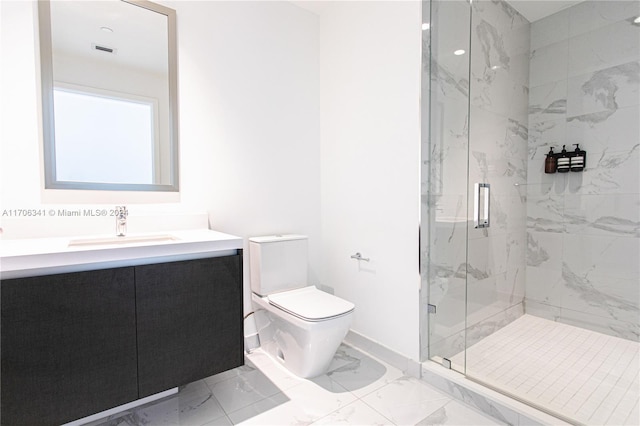 bathroom with vanity, toilet, and an enclosed shower