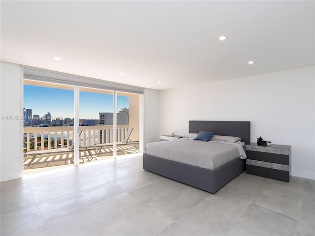 bedroom featuring floor to ceiling windows