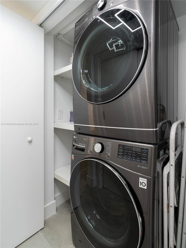 laundry area with stacked washer and dryer